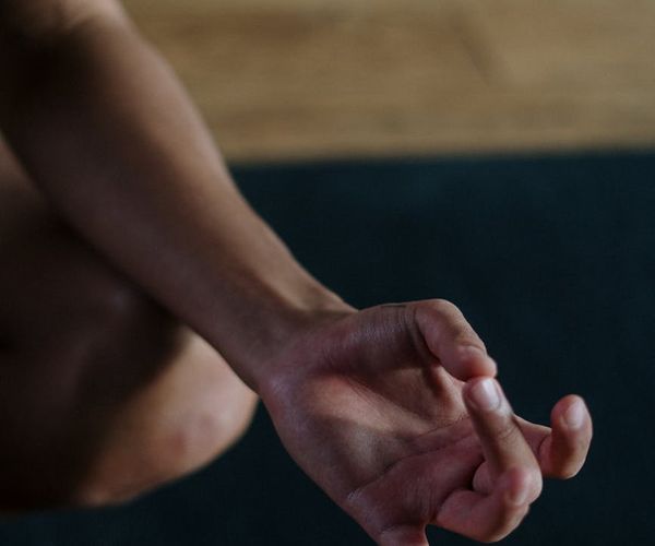 Detail of hands making a yoga mudra